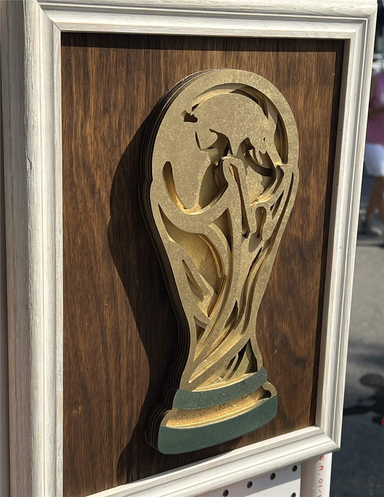 Layered wood art of the World Cup trophy